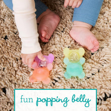 Two silicone bear teethers, orange and mint colors, textured belly pop surface