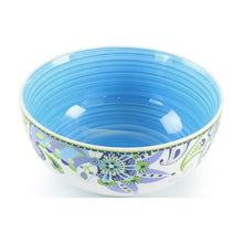Porcelain serving bowl with blue interior and blue-green floral pattern