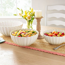 Cream stoneware nesting bowls set of 3 filled with salad and vegetables