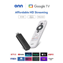 Streaming device and white voice remote with buttons, tilted beside black puck