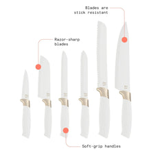 Six white knives with gold collars and serrated edges