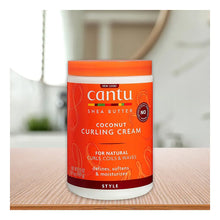Cantu coconut curling cream jar with orange lid and label for natural curls