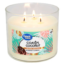Great Value coastal coconut scented candle with flame in clear glass jar