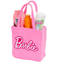 Pink Barbie tote bag with groceries and drink bottle