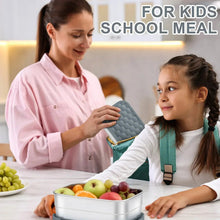 Stainless steel lunch box with grey silicone lid on table for kids school meal
