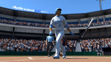 Baseball player in light blue jersey and cap swinging bat during gameplay