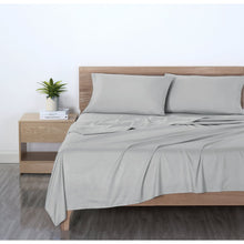 Light silver gray microfiber bed sheet set on bed with two pillowcases