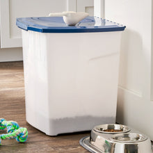 Dog food storage pail with blue lid on a floor; white body with latching bar