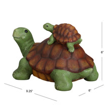 Garden turtle figurine with baby turtle perched on shell, green legs and orange-brown shell