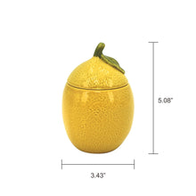 Yellow ceramic lemon candle with leaf-topped lid, 5.08 in tall