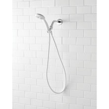 White handheld showerhead and hose with round wall mount on white tile wall