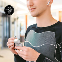 Black true wireless earbuds worn with a metal clip on a black shirt