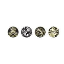 Set of four coin tokens with black and gold Pokémon-style character symbols