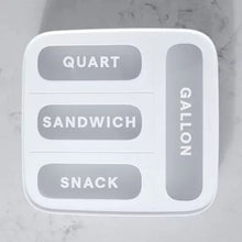 White food bag dispenser with labeled compartments for quart, sandwich, and snack