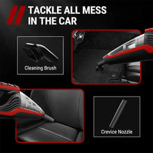 Red and black handheld vacuum with cleaning brush and crevice nozzle for car