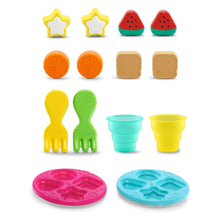Assorted shape-sorting food pieces and two snack plates with cups