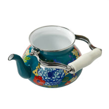Teal enamel tea kettle with colorful floral design, arched metal handle, open lid.