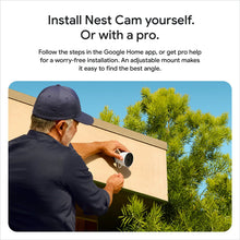 Person installing an outdoor security camera with adjustable mount on a wall