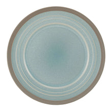 Round stoneware salad plate with blue speckled glaze and tan edge.