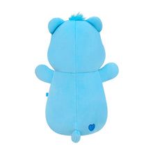 Blue plush bear toy from back view with small heart detail and soft fuzzy top tuft