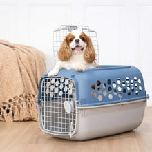 Blue and white plastic pet kennel with front wire door and honeycomb side vents