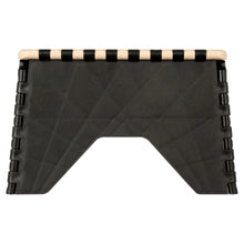 Plastic step stool side view, black legs with beige top edge and striped tread
