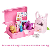 Pink open travel suitcase with puppy, bottles, and purple cat-face backpack