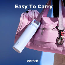 Insulated stainless steel bottle with straw lid, carried in a shoulder bag