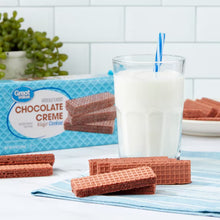 Chocolate creme wafer cookies with wafer layers and cream filling, blue package behind