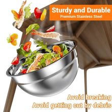 Stainless steel mixing bowl filled with salad ingredients, round bowl and rim