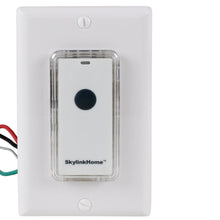 White wall light switch with removable snap-on remote, clear cover and black button.