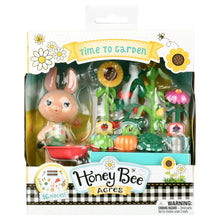 Garden playset in retail box with bunny figure and miniature garden accessory pieces