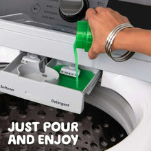 Green liquid detergent poured into washing machine detergent compartment