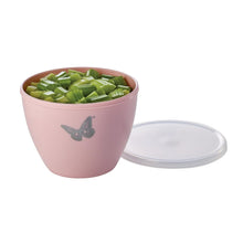 Blush plastic mixing bowl with airtight lid, filled with chopped green vegetables, butterfly decal