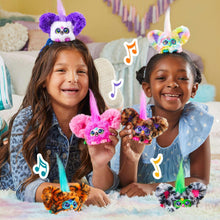 Pink mini electronic plush toy with horn, held by two smiling kids