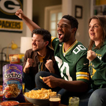Tostitos Scoops! tortilla chips bag on party table with chips bowl