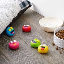 Five colorful buddy dog toys with smiling emoticon faces