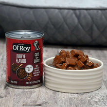 Ol'Roy ribeye cuts in gravy wet dog food can with white serving bowl