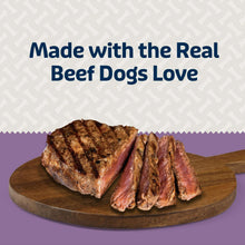 Beef dog treats, soft and chewy bites on a round wooden serving board