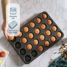 Nonstick mini muffin pan with baked cupcakes in shallow round cups on marble