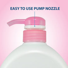 Goat's milk body wash bottle with pink pump nozzle close-up