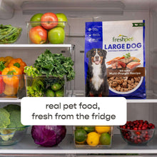 Freshpet Large Dog bag in a refrigerator with fresh produce around it