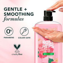 Herbal Essences Rose Hips shampoo bottle with black pump and hand on top