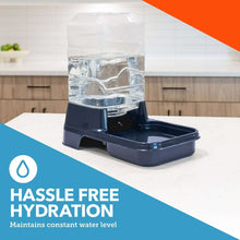 Navy gravity pet waterer with clear bottle and front drinking bowl