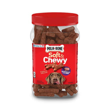 Red canister of soft & chewy dog treats with brown bone-shaped biscuits