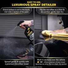 Detailer spray bottle in use with microfiber cloth on a car panel