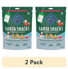 Two Santa Snacks dog biscuit pouches in green packaging, baked oatmeal & cinnamon.