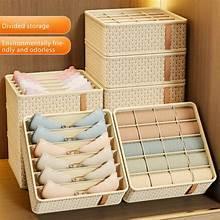 Stacked foldable drawer organizers with grid compartments; one holds folded socks, light beige
