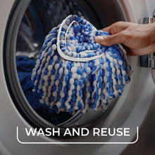 Microfiber mop head bundle held in hand above water-filled rinse tank