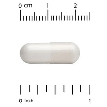 Calcium supplement capsule, white oval shape shown beside measurement marks